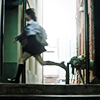 one of the newjeans members running in a school in the newjeans ditto music video