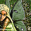 a black woman dressed as a forest fairy
