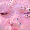 a face with eyes closed in pink water