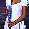 aesthetic photo of a model holding a knife but from a different lower angle