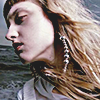 aesthetic photo of a model with her head tilted and her hair blowing in the wind