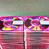 two stacks of pink blank mini discs