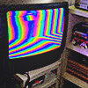 CRT television showing colorful angled bars