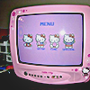 pink hello kitty themed CRT television showing hello kitty graphics on the screen