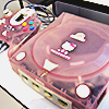 pink translucent hello kitty themed sega dreamcast console