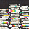 stacks of labeled VHS tapes by their spines