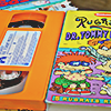 a rugrats orange VHS tape next to its sleeve