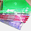 a stack of colorful empty CD jewel cases