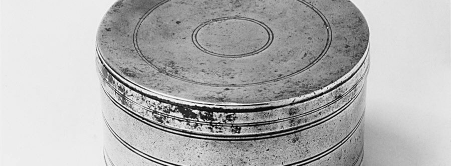 Round metal box.