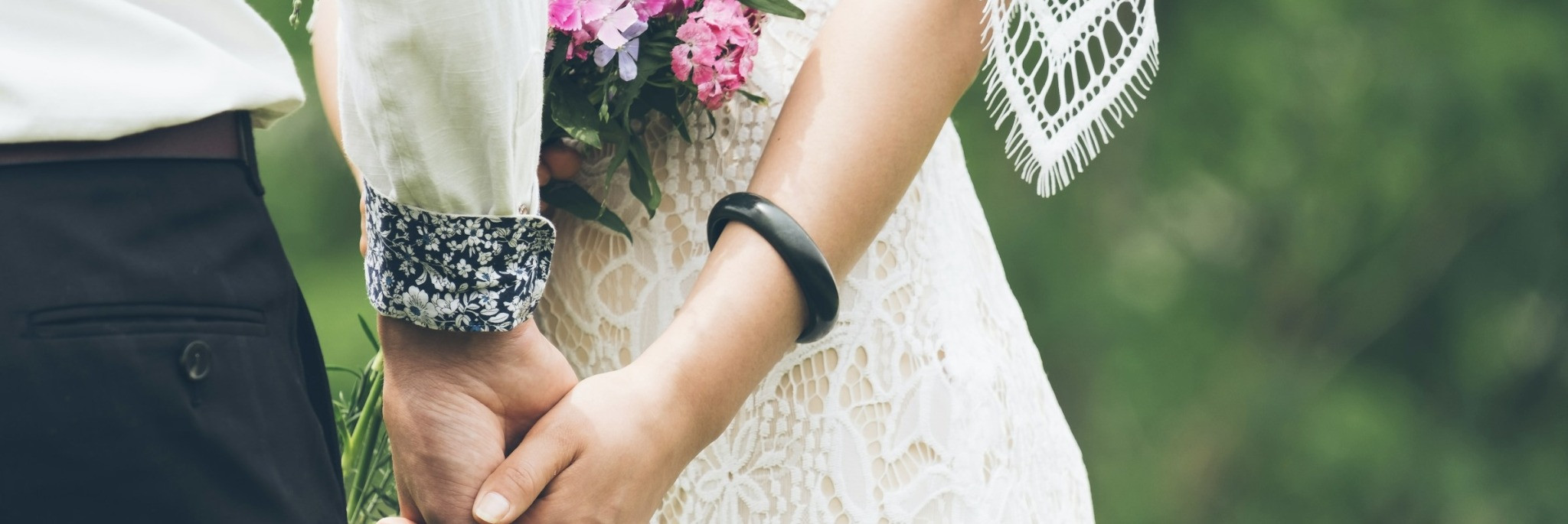 banner of bride and groom holding hands