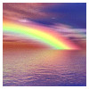 rainbow over sea at sundown