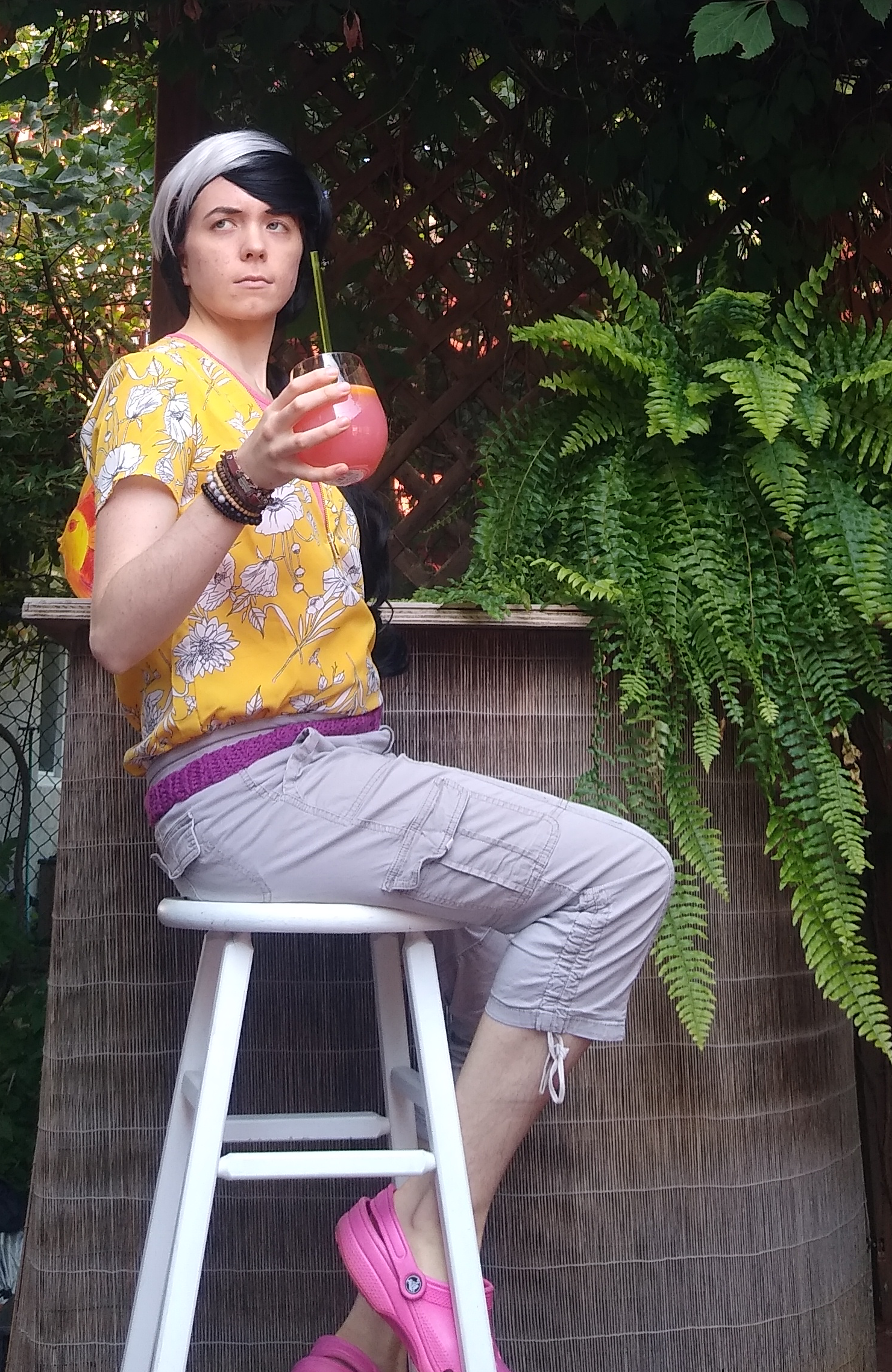 Myself cosplaying an alternate design of Simon Blackquill from Ace Attorney: Dual Destinies. I'm holding a glass in my hand and staring at the camera judgmentally.