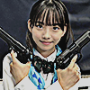 off shot of kudo rinne holding two hand guns from kamen rider gotchard