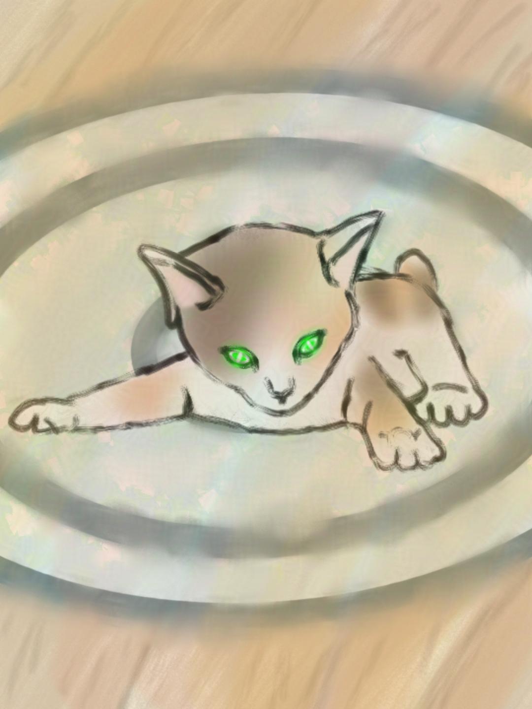 A small Japanese Bobtail kitten with glowing green eyes, splayed out on it's stomach on a light greenish blue rug on top of pale yellow floorboards. There is a soft yellowish tinge to the entire image.