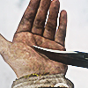 lottie cutting her hand with a knife in yellowjackets