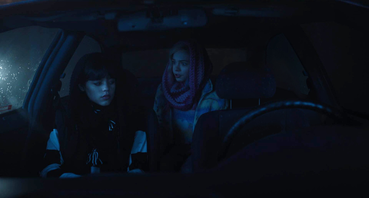 Wednesday and Enid in a car without a driver.