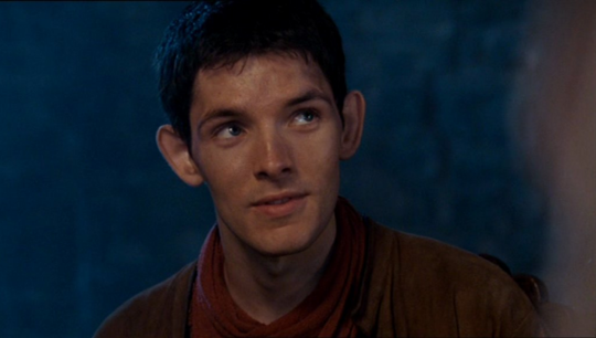 a shot of Merlin in the round table episode looking up at Arthur with a grin on his face.