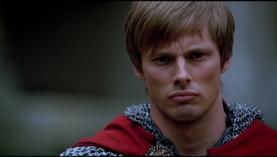a shot of Arthur staring into the fire looking very grieved at Lancelots funeral pyre.