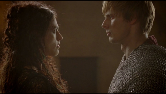 arthur and morgana facing each other backlit by sunlight right before they are about to fight