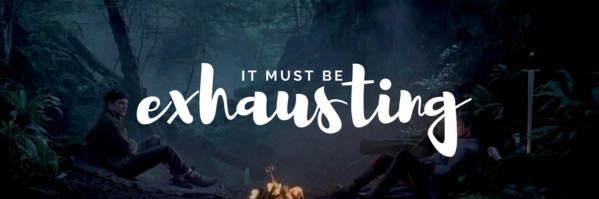 a zoomed out shot of Merlin and Arthur sitting across from each other at the fire in the Disir episode the text on the image reads it must be exhausting.