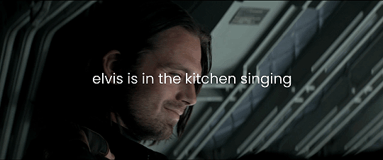 a gif of Steve clapping Bucky on the shoulder right before they get off the plane to go into the bunker in Siberia and they both look at each other emotionally and the text on the gif reads elvis is in the kitchen singing.