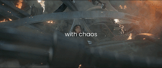 a gif of Bucky hanging from the Helicarrier as Steve and debris fall into the river and the text on the gif reads with chaos.