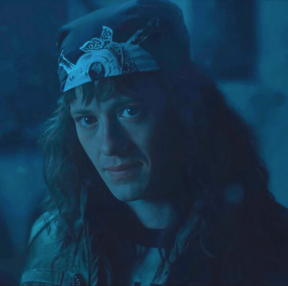 a picture of Eddie in the upside down as they are about to go into the final battle and he is looking seriously at Steve right after he has said make him pay.