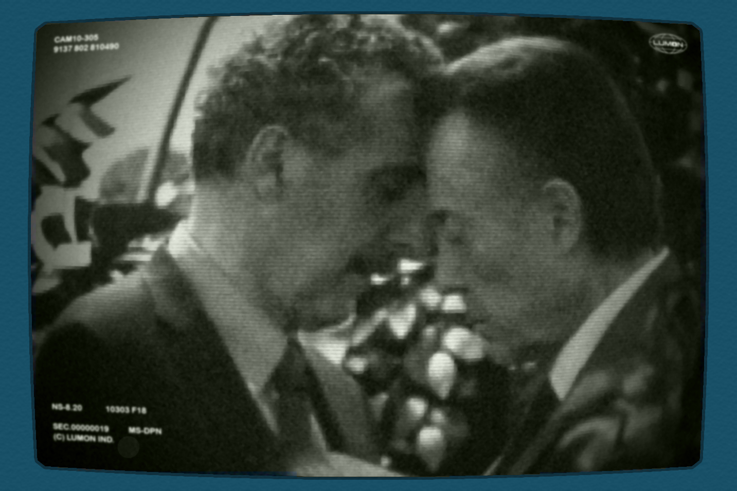 A black-and-white picture of Burt and Irving with their foreheads touching. It is surrounded by a blue border.