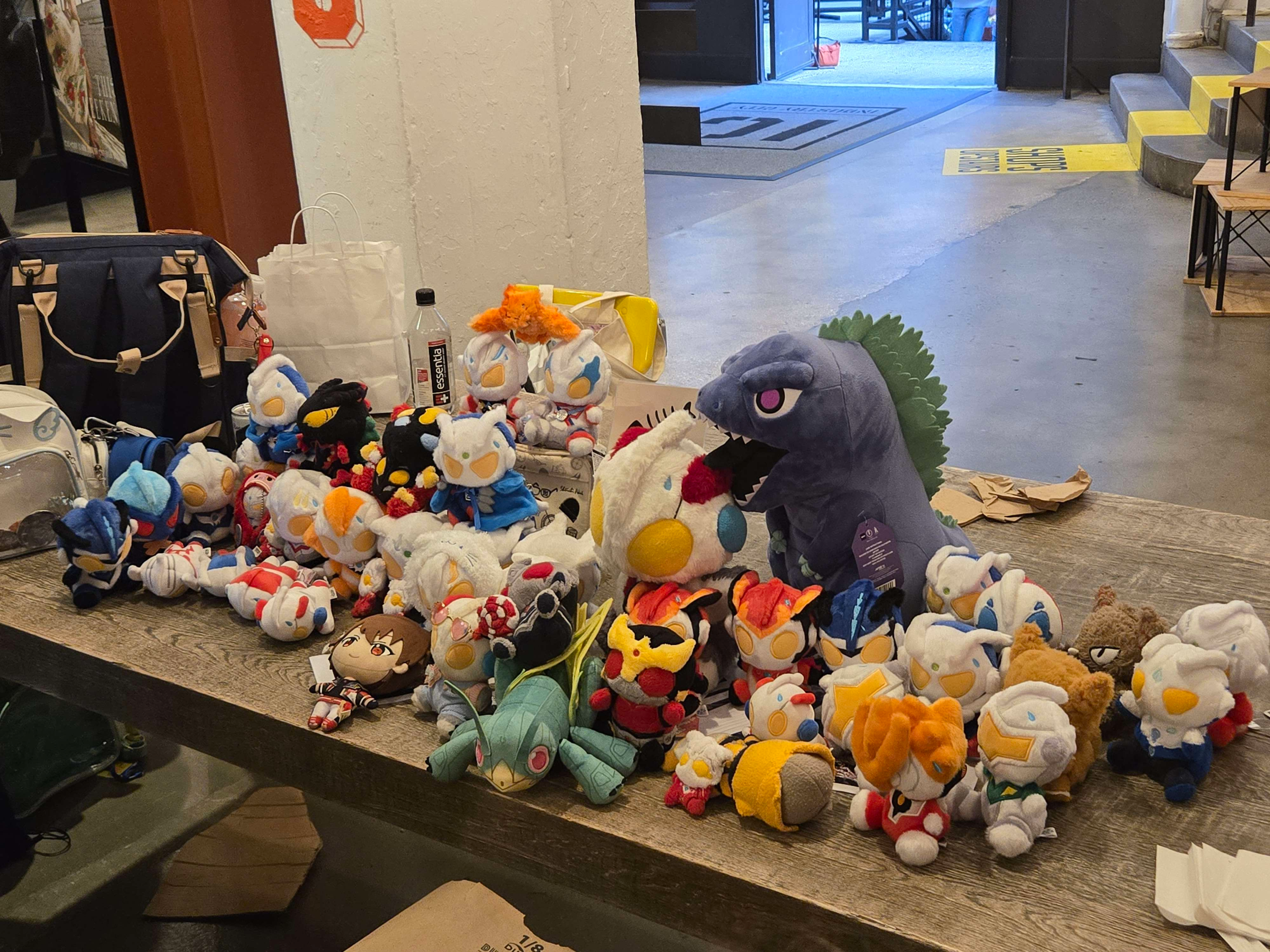 A bunch of Ultraman plushies, including a Godzilla, Hopper1, and Kamen Rider Kuuga.