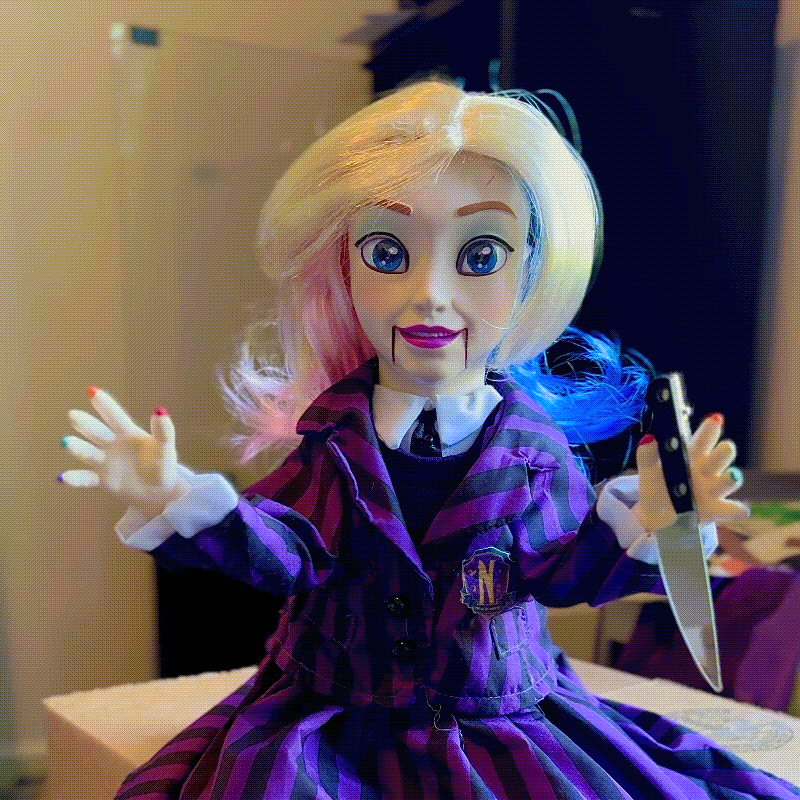 Creepy animatronic Enid Halloween doll