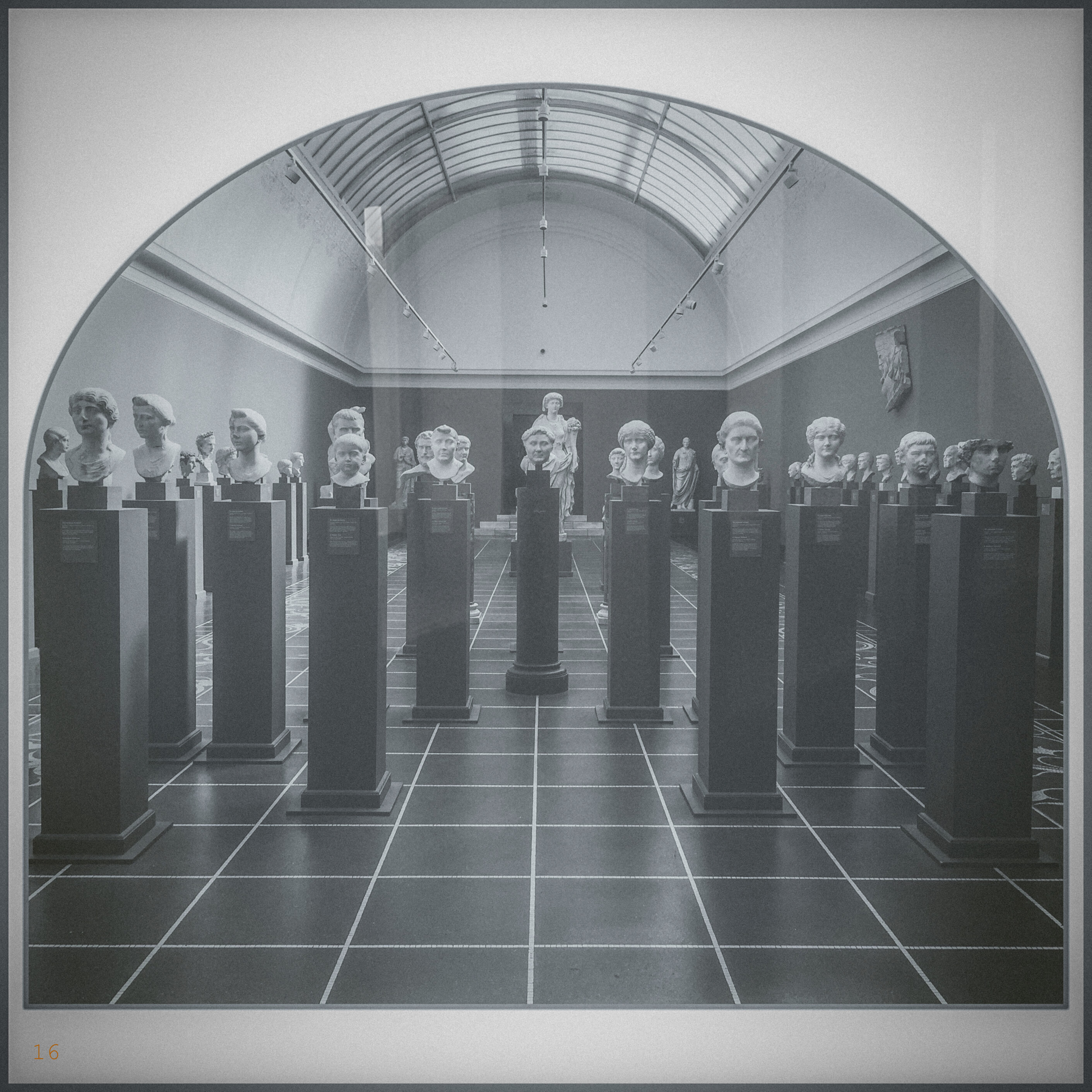 A black and white photo of statues. The photo is dreamlike. In the bottom lefthand corner is a small '16'.