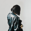 a person from behind wearing a leather jacket