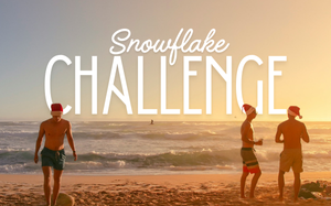 Snowflake Challenge: Three men wearing santa hats standing on the beach at sunset