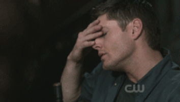 .gif of Dean Winchester sighing and rubbing his forehead