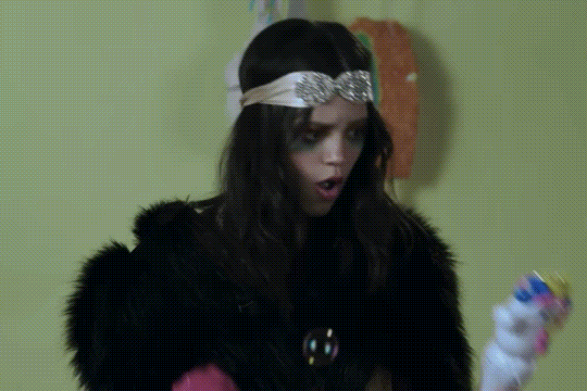 Jenna Ortega dancing around with a unicorn bubble wand from a “Yes Day” promo.