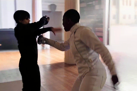 Bianca and Wednesday fencing, resulting in Bianca pinned.