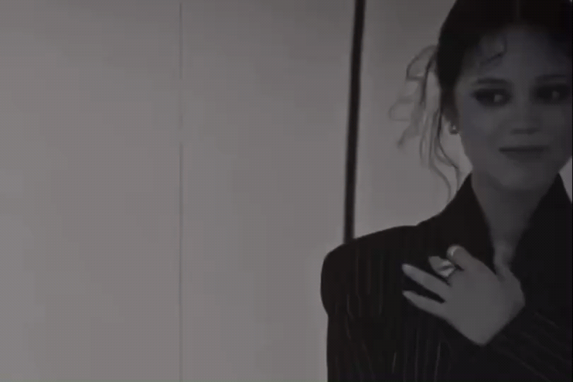 Wednesday bursting into laughter.