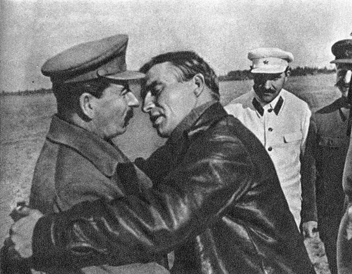 Russian pilot leaning in to kiss Stalin