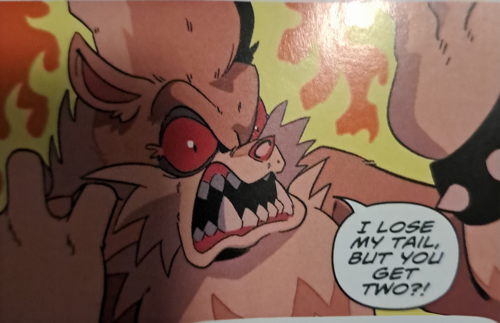 Panel with Rough the Skunk making a crazed expression with flames behind him. He says, I lose my tail, but you get two?!