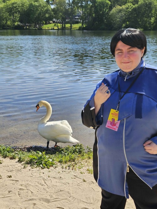Me in my cosplay with a Swan being fed in the background.