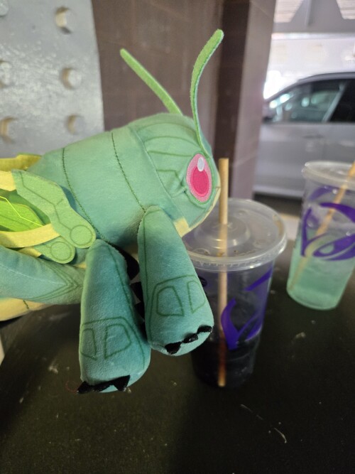 Hopper1 plush by a coke.
