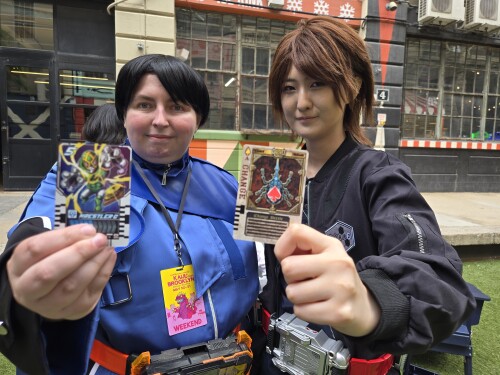 Me with a Kenzaki cosplay as we hold up our cards.