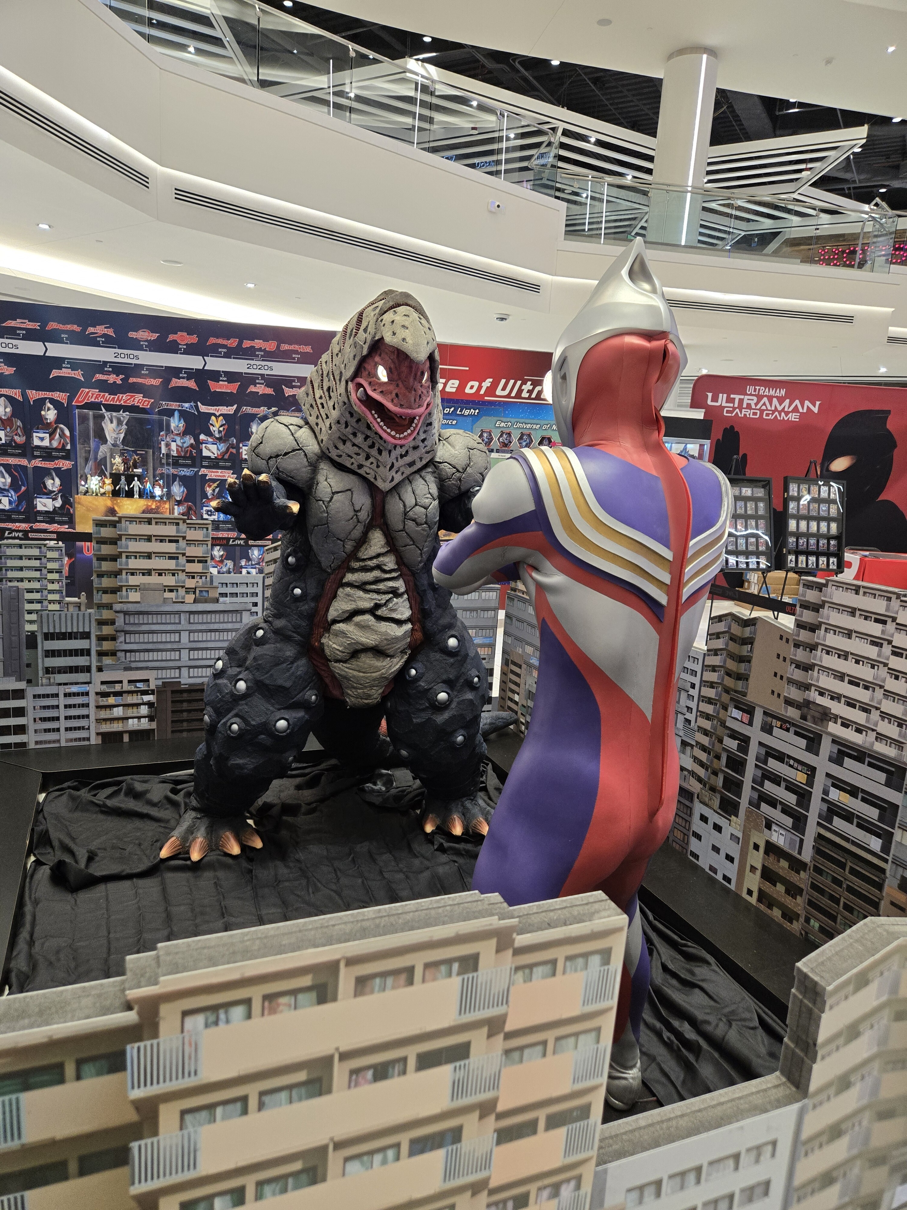 Tiga and Kaiju statues.