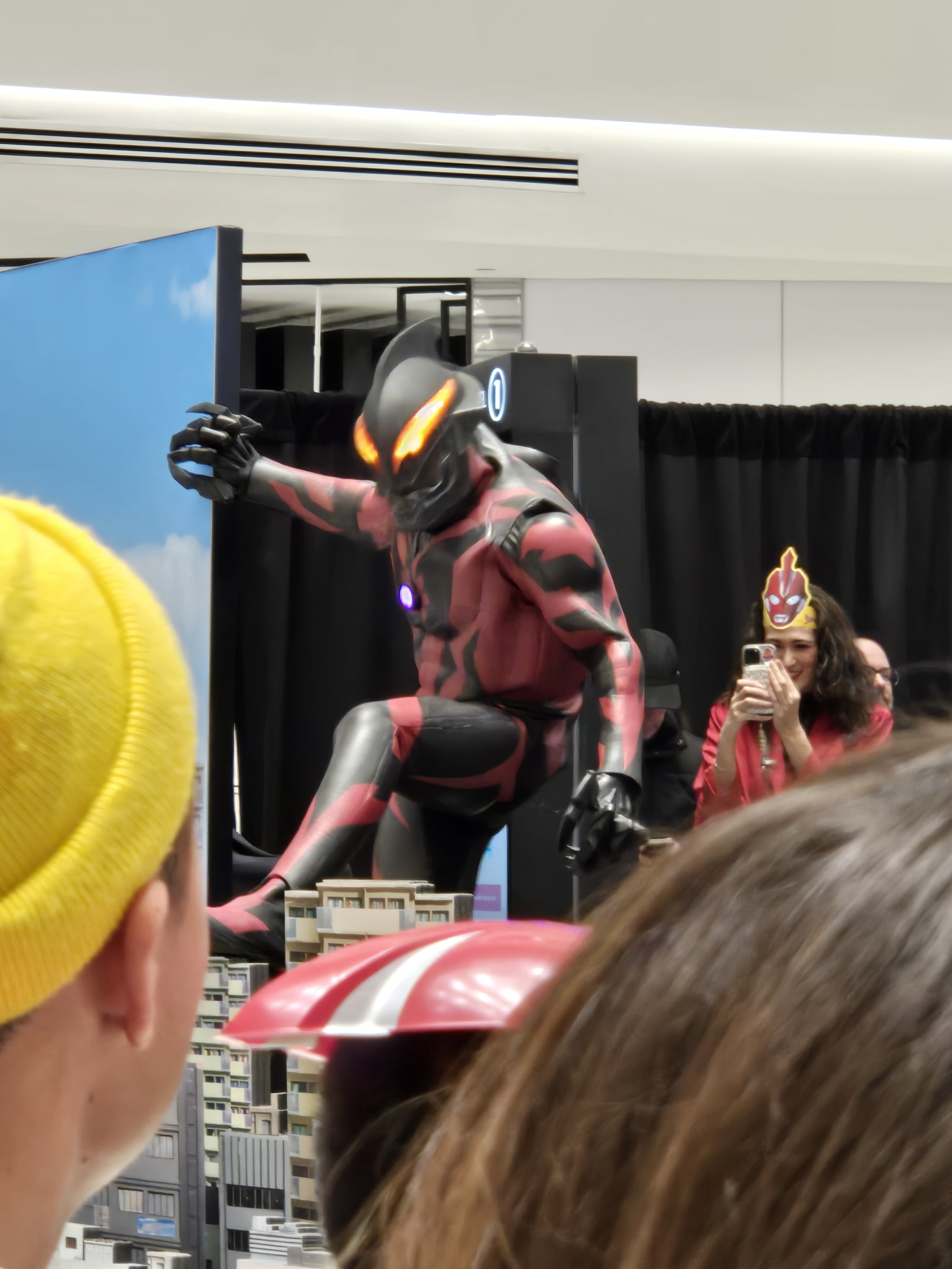 Belial standing and looking towards the audience.