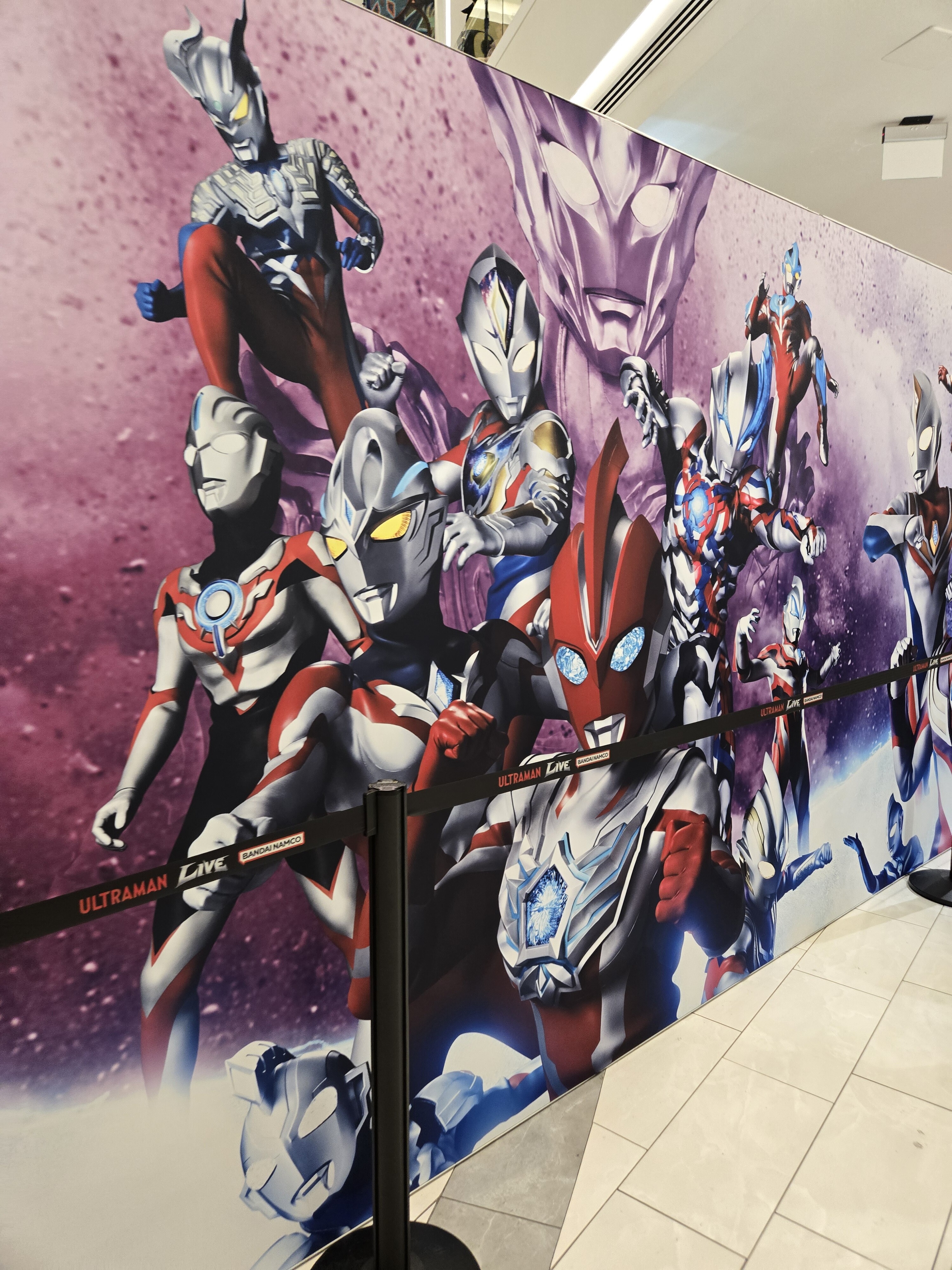 Various Ultramen on a wall.