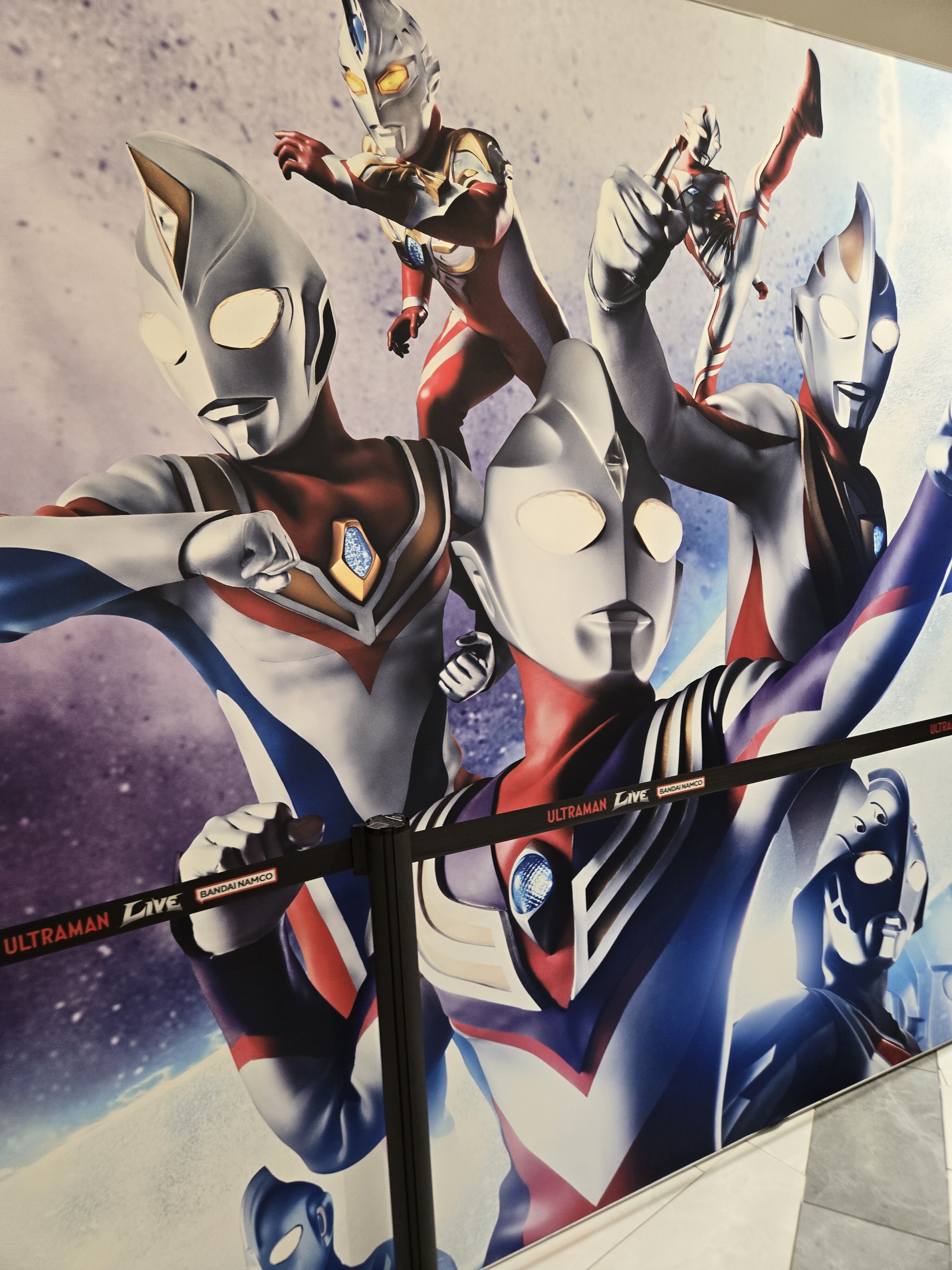 Various Ultramen on a wall.