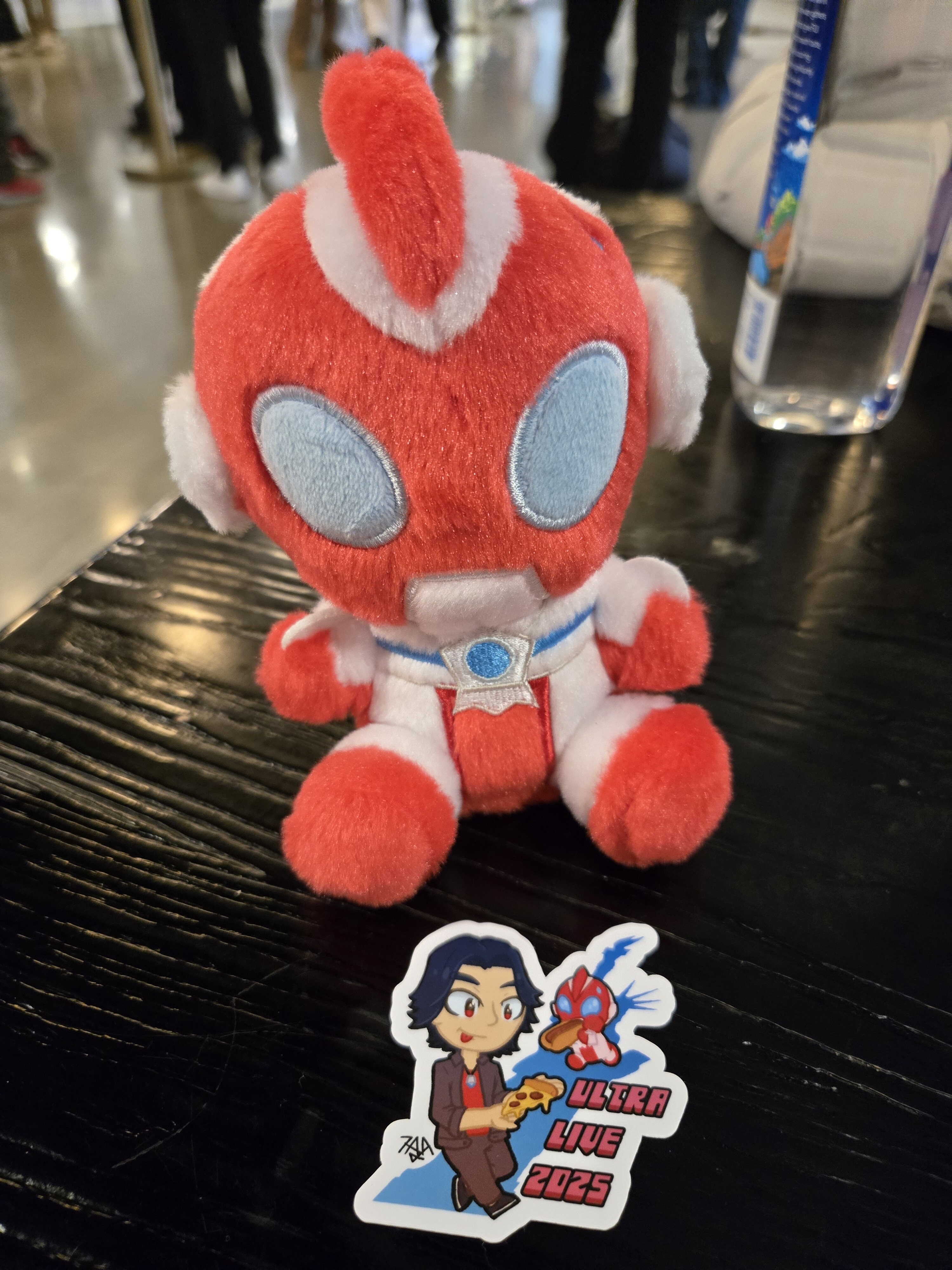 My Omega plushie with a sticker of Sorato.