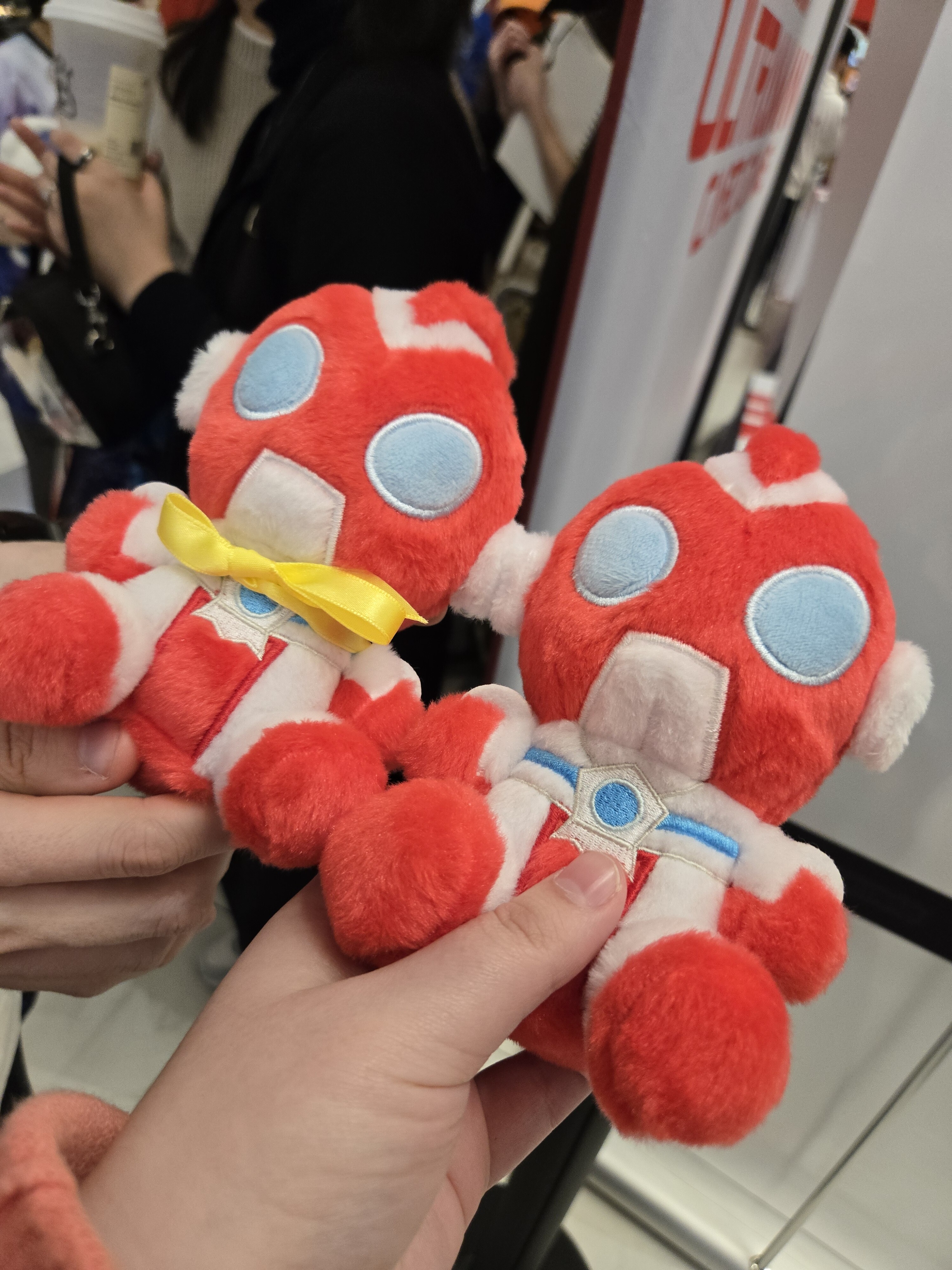 Two Omega plushies together